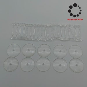 May include: A set of clear plastic miniature bases for wargaming. The set includes 20 clear plastic bases and 10 clear plastic stems. The bases are round and have a diameter of approximately 1 inch. The stems are about 1 inch tall.