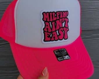 MILFin’ Ain’t Easy Neon White/ Pink Foam Front Otto Trucker Hat