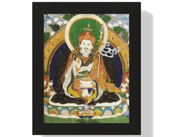 May include: Framed artwork featuring a seated figure with a halo, holding a staff. The figure is adorned in colorful robes with gold accents. The background includes a green and gold halo, with a blue and yellow backdrop. The artwork is in a black frame.
