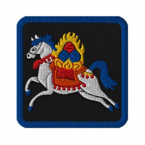 May include: A square embroidered patch with a black background and a blue border. The design features a white horse in motion, adorned with a red saddle, yellow flames, and blue accents. The horse has a blue mane and tail, with blue hooves.