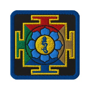 May include: A square embroidered patch with a colorful mandala design. The mandala features a blue, yellow, and green flower with a red and gold border. The center of the mandala contains a yellow symbol with a blue figure.