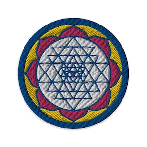 May include: Embroidered patch featuring a Sri Yantra design. The patch has a blue border, a yellow and pink lotus flower design, and a white and blue geometric pattern at the center. The center of the design has a small red dot.