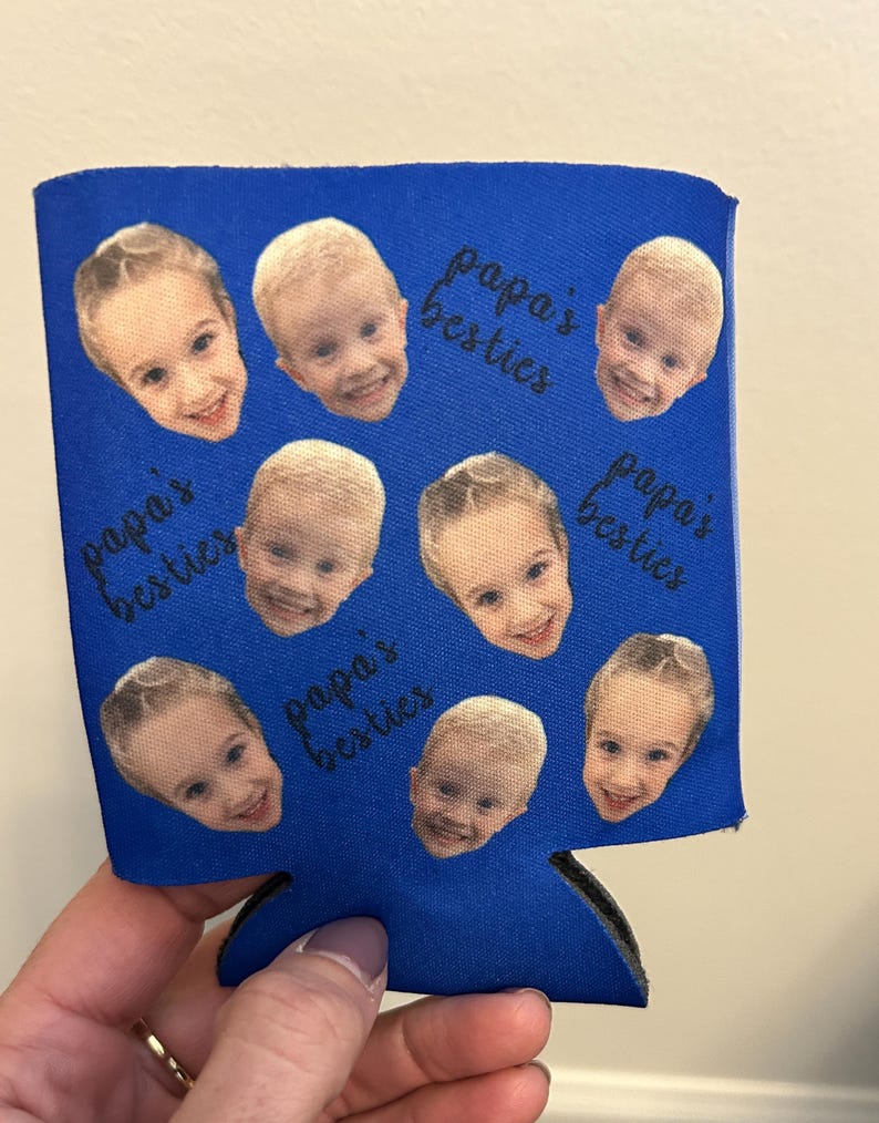 May include: Blue can cooler with multiple photos of children's faces and the text "papa's besties" repeated around the images.