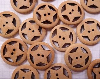 May include: A collection of 14 wooden buttons with a star design. The buttons are light brown and have two holes each.