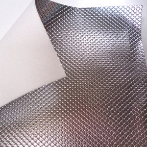 May include: Silver faux leather with a textured, fish scale pattern.