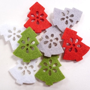 May include: Assortment of felt Christmas tree decorations in red, green, and white. Each tree has a snowflake design cut out in the centre.