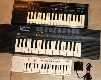 Casio Lot of 3 Keyboards SK-1 / SA-20 / Realistic Concertmate 350 and AC Adapter Vintage 1980s