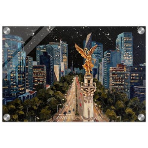 May include: An acrylic print of a cityscape at night. The artwork shows a wide avenue lined with trees, leading to a monument topped with a golden statue. Tall buildings with lit windows flank the avenue under a starry sky.