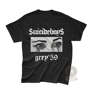 May include: Black t-shirt with the text "$uicideboy$" above a rectangular image of crying eyes. Below the image is the text "grey*59". The shirt has a crew neck and short sleeves.