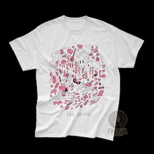May include: White t-shirt with a pink doodle design featuring a dog, a guitar, a cloud, and the text "This Old Dog".