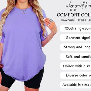 May include: A purple, heavyweight unisex t-shirt made of 100% ring-spun cotton. The shirt is garment-dyed, soft, and comfortable. It features a relaxed fit and is available in sizes S to 3XL.