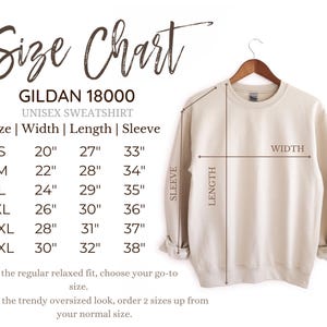 May include: Size chart for a Gildan 18000 unisex sweatshirt. The chart shows measurements in inches for width, length, and sleeve length for sizes S, M, L, XL, 2XL, and 3XL. The chart also includes instructions for choosing the right size for a relaxed fit or an oversized look.