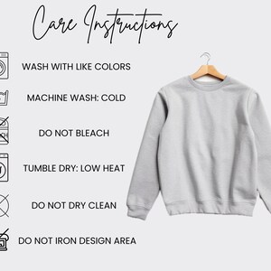 May include: Care instructions for a gray sweatshirt. The instructions include washing with like colors, machine washing cold, not bleaching, tumble drying on low heat, not dry cleaning, and not ironing the design area.
