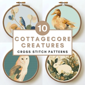 May include: A collection of ten cross-stitch patterns featuring cottagecore creatures, displayed in wooden embroidery hoops. The designs include a bluebird, duck, owl, and rabbit, with the text "10 Cottagecore Creatures Cross Stitch Patterns" in the center.