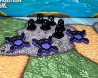 May include: A board game with black and purple game pieces. The game pieces are on a colorful game board with a water scene and the words "Creative Construction Game".