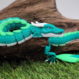 Juguete sensorial flexible con forma de dragón de hoja impreso en 3D