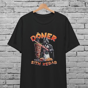 May include: Black t-shirt with a graphic of Darth Vader holding a large kebab and the text "DONER SITH KEBAB".
