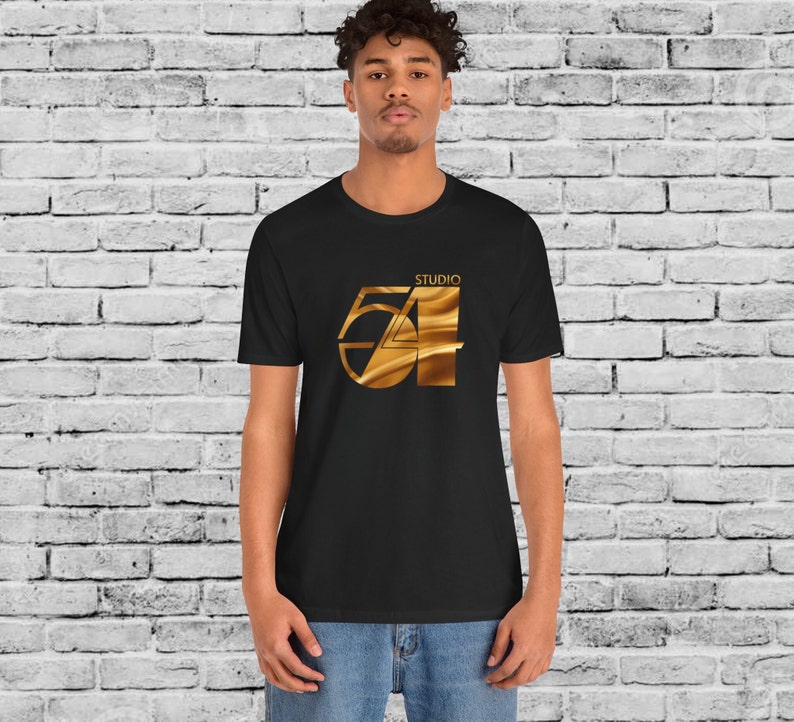 May include: A black t-shirt with a gold graphic of the number 54 with the word "Studio" above it.