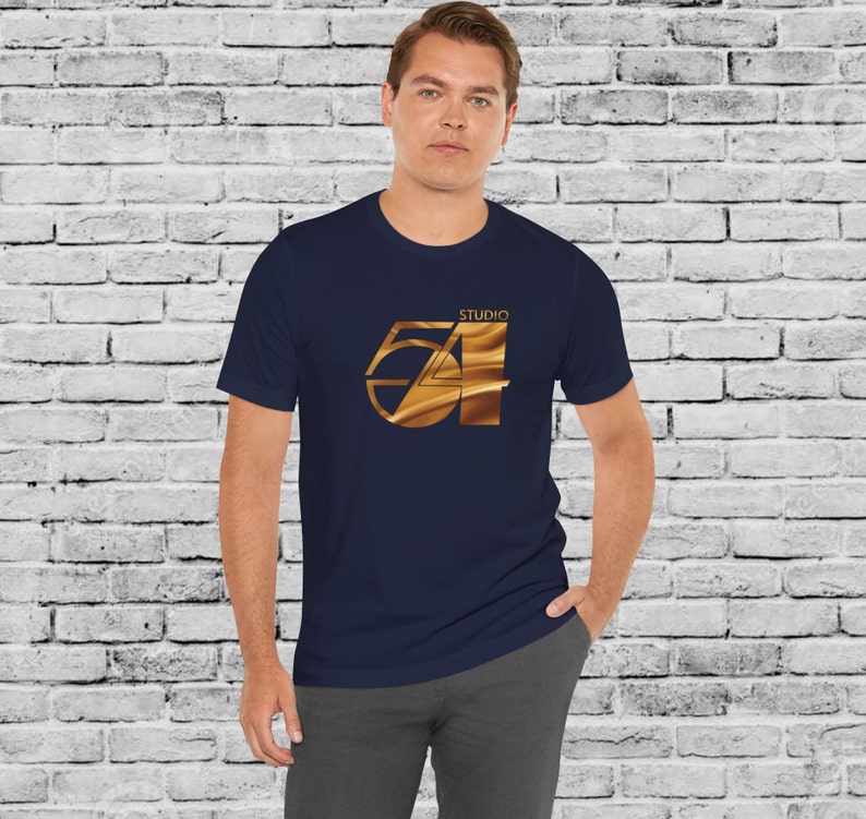 May include: A navy blue t-shirt with a gold metallic graphic of the number 54 and the word "Studio" above it.