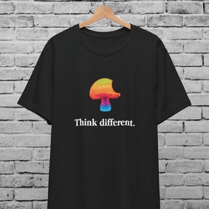 May include: Black t-shirt with a rainbow mushroom graphic and the text "Think different."