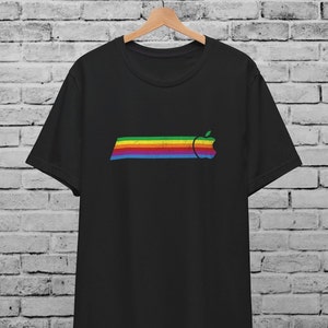 May include: Black t-shirt with a rainbow stripe and a vintage Apple logo.