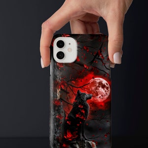 May include: Black wolf silhouette phone case with a red moon and red leaves on a black background.