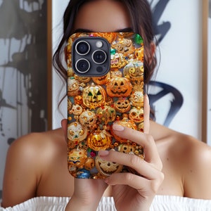 May include: A phone case with a Halloween theme featuring a pattern of gold and orange jack-o'-lanterns.