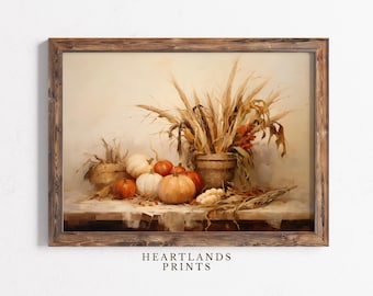 May include: A framed still life painting featuring a rustic arrangement of pumpkins, gourds, and wheat stalks. The pumpkins vary in color from orange to white. The artwork is set against a neutral background, with the text "HEARTLANDS PRINTS" at the bottom.
