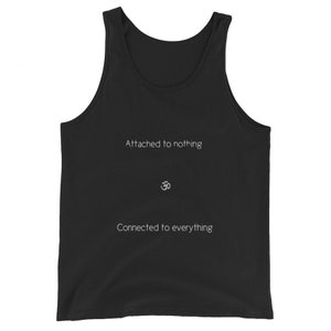 May include: Black tank top with the text "Attached to nothing" and "Connected to everything" in white. The Om symbol is centered between the two phrases.