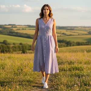 May include: A white ceramic mug with a black handle and the text "But First, Coffee" in a bold, black font. The mug is set against a blurred background, suggesting a cozy setting.