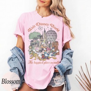 May include: A white ceramic mug with a black handle and the text "But First, Coffee" in a black, bold font. The mug is on a white surface. The mug is approximately 4 inches tall.