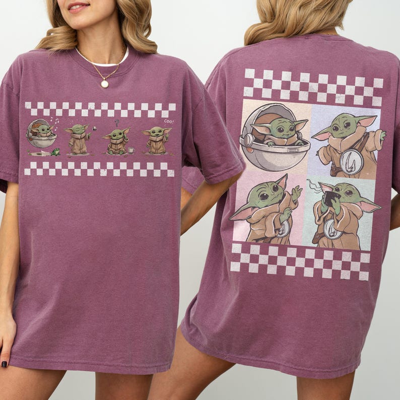 May include: A maroon t-shirt featuring a cartoon character design. The front of the shirt displays a series of the character in a checkered pattern. The back of the shirt has a larger design of the character in a checkered pattern.