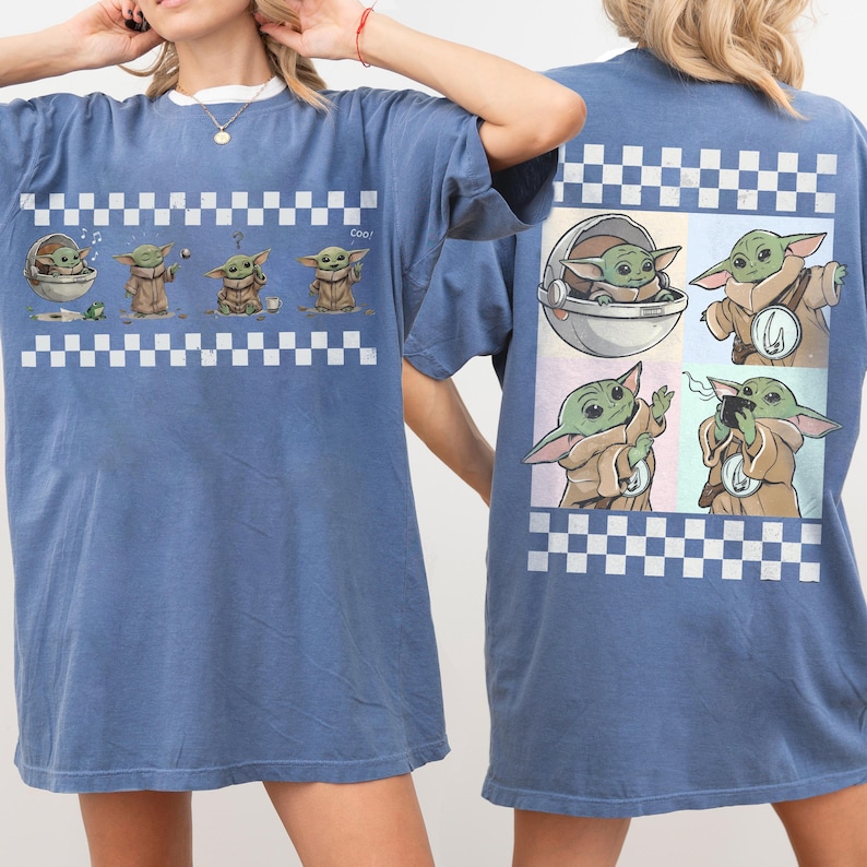 May include: Blue t-shirt featuring a cartoon character in various poses, with a white and black checkered border. The front of the shirt shows the character in a series of images. The back of the shirt has a similar design.
