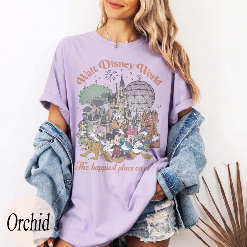 May include: A white ceramic mug with a black handle and the text "But First, Coffee" in a bold, black font. The mug is set against a blurred background, suggesting a cozy setting.