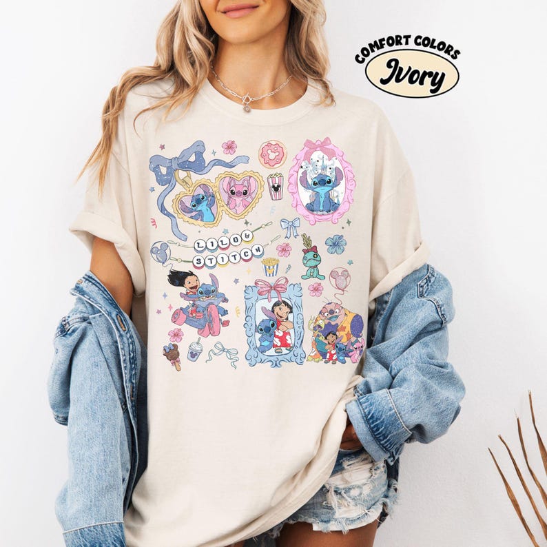 May include: Ivory-colored t-shirt featuring a collage of cartoon characters and decorative elements. The design includes framed images, bows, hearts, and the text "Lilo & Stitch." The shirt is labeled "Comfort Colors" and "Ivory."