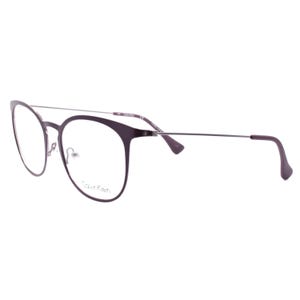 May include: A pair of Calvin Klein eyeglasses with a dark purple frame and silver-colored arms. The lenses are clear, and the brand name is printed on the lower left of the frame. The glasses have a modern, minimalist design.