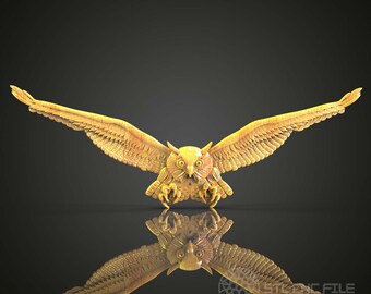 May include: A golden owl sculpture with its wings spread wide, as if in flight. The owl's eyes are wide open and its talons are extended. The sculpture is reflected in a black surface.