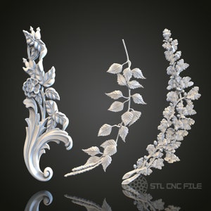 May include: Three white 3D printed floral designs. The designs are of a rose, a fern, and a cluster of small flowers. The designs are all in a similar style, with a delicate and intricate design.