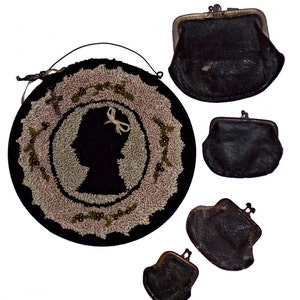 May include: A collection of vintage items, including a black silhouette wall hanging with a floral border and a black leather coin purse. The wall hanging features a silhouette of a woman's profile. Several black leather coin purses are also shown.