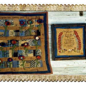 May include: A brown and blue patchwork quilt with a floral design and the text "A garden ever blooming just for you" and a framed piece of embroidery with the text "My Mother Of all the flowers that grow In my garden of memory to thoughts of mother I owe The happiest of flowers".