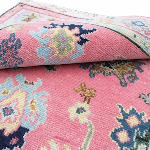 May include: A set of three ceramic mugs with a speckled, matte finish. The mugs are in shades of cream, light gray, and dark gray. Each mug has a simple, minimalist design and a rounded handle.