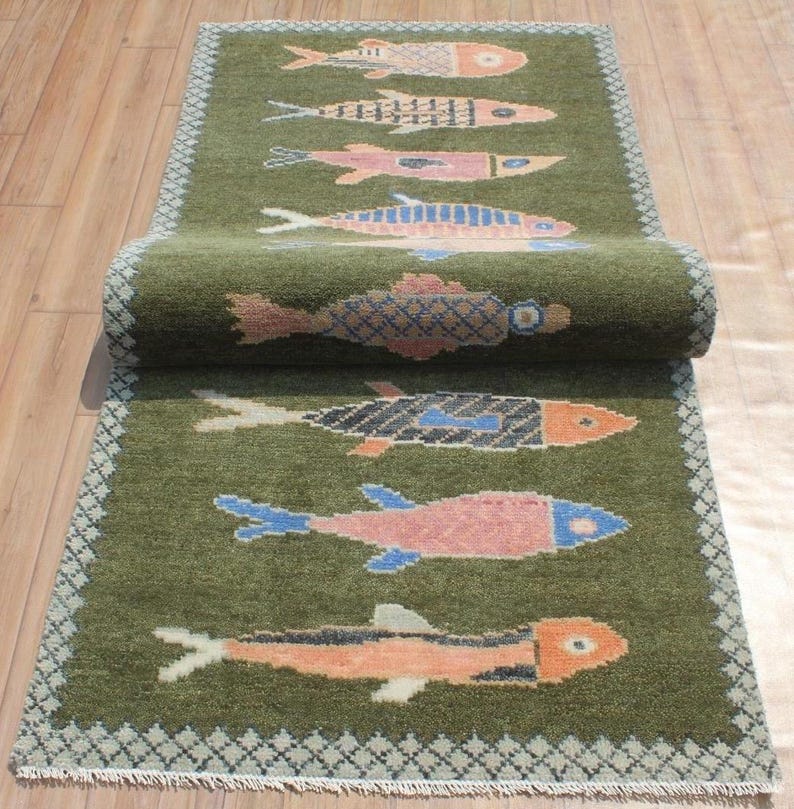 Rolled koi runner showing wool pile and handmade texture