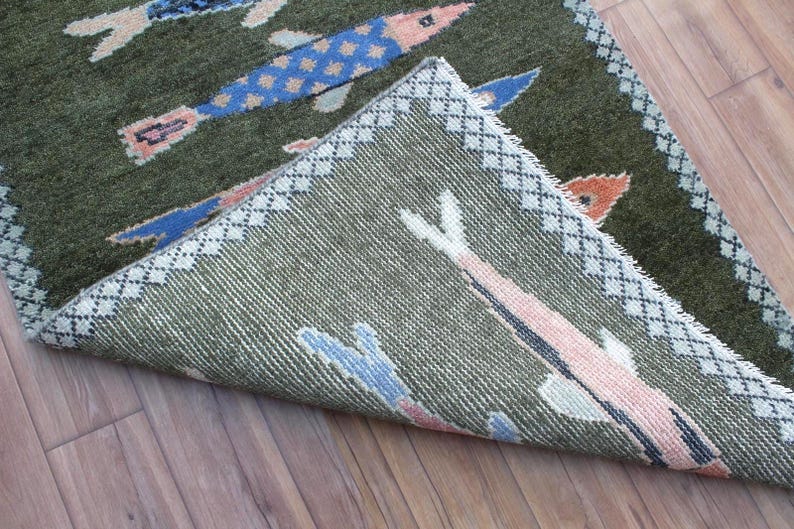 Folded koi fish runner showing woven underside