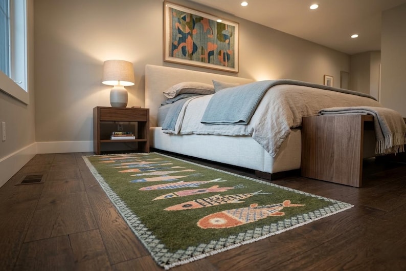 Green koi fish wool runner styled beside a bed
