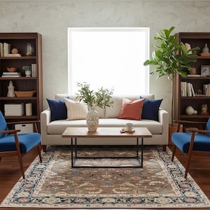 Large 9x12 neutral Oushak rug centered in a bright living room under a wooden coffee table.