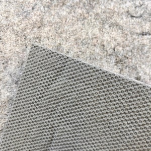 May include: Close-up of a gray woven fabric with a fine, even texture. The fabric has a slightly rough surface.
