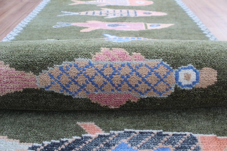 Close detail of colorful koi motifs and wool rug texture