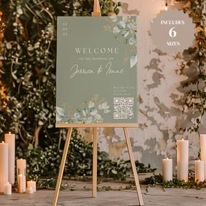 May include: A green welcome sign with gold accents and greenery. The sign reads "Welcome to the wedding of Jessica & Isaac" and includes a QR code with the text "Please scan to find your seat".