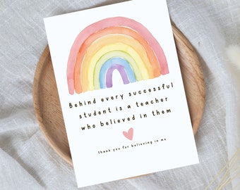 May include: A white card with a watercolor rainbow design. The card has the text "Behind every successful student is a teacher who believed in them" and "thank you for believing in me" with a pink heart.