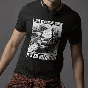 May include: A black t-shirt with a white graphic of a person playing a piano. The graphic has the text "I love classical music. It's so relaxing."
